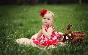 little_princess_sitting_on_grass-wide